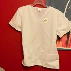 Women’s scrub top. Brand new. All white with pockets
